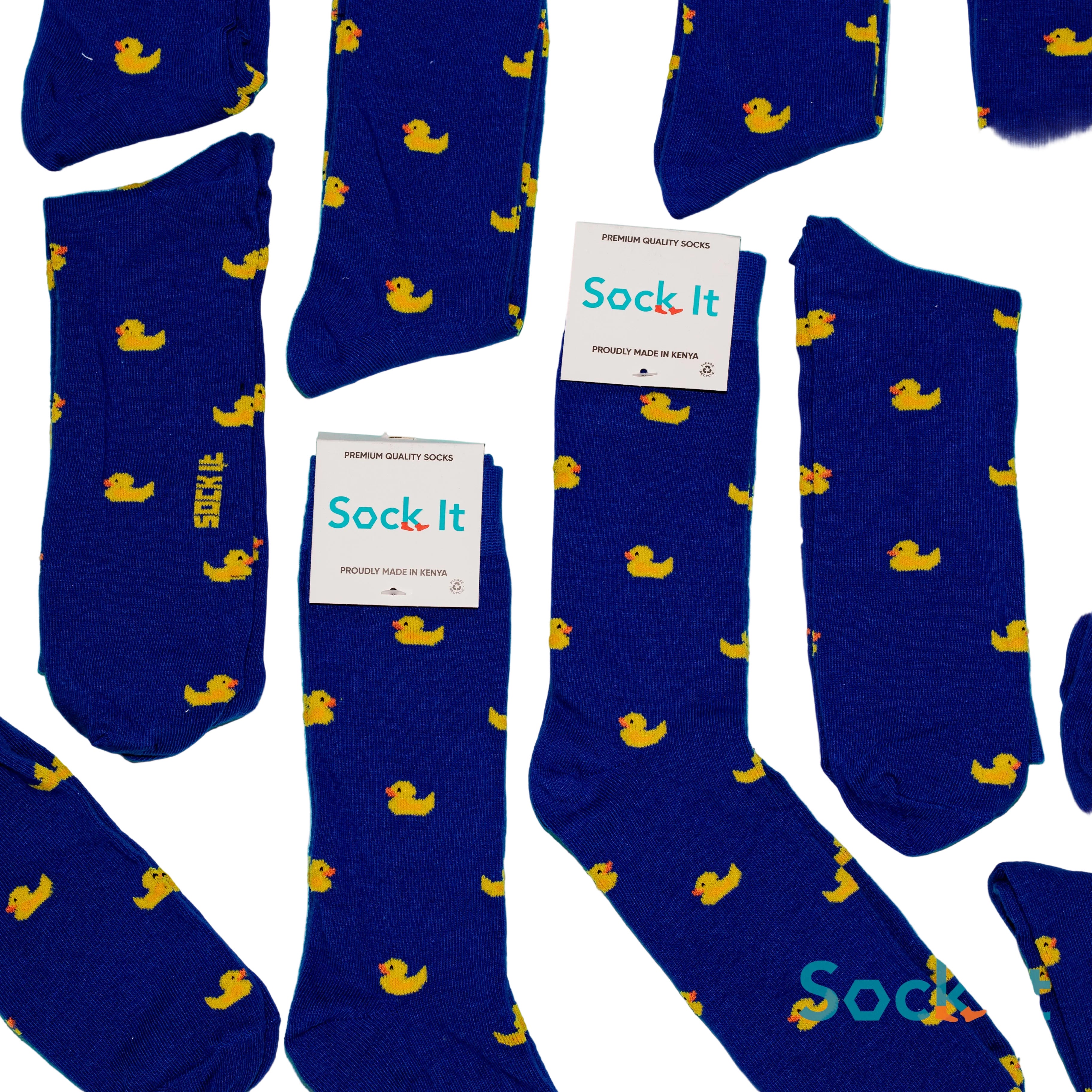 Blue socks with yellow duck patterns and 'Sock It' labels on a blue background