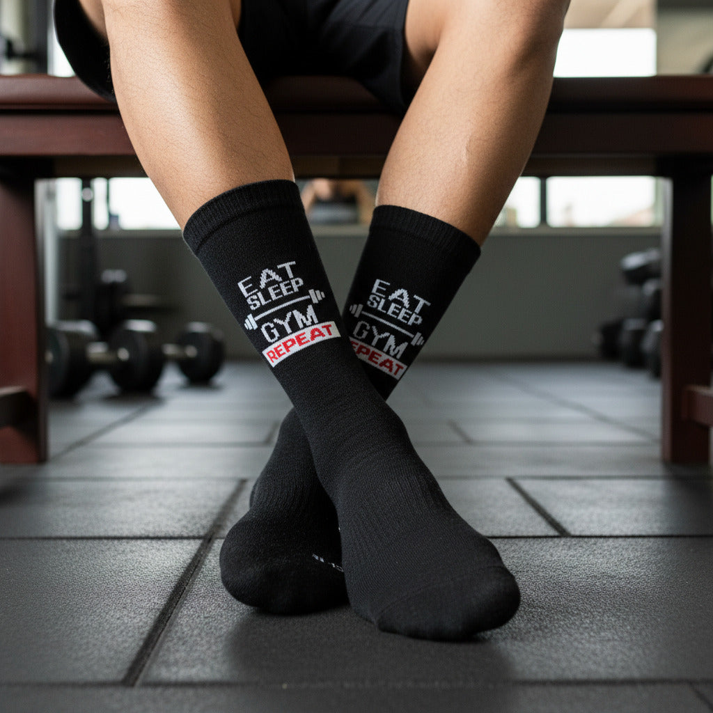 Sock It "Eat Sleep Gym Repeat" graphic socks in black and white with red accent and barbell design, proudly made in Kenya