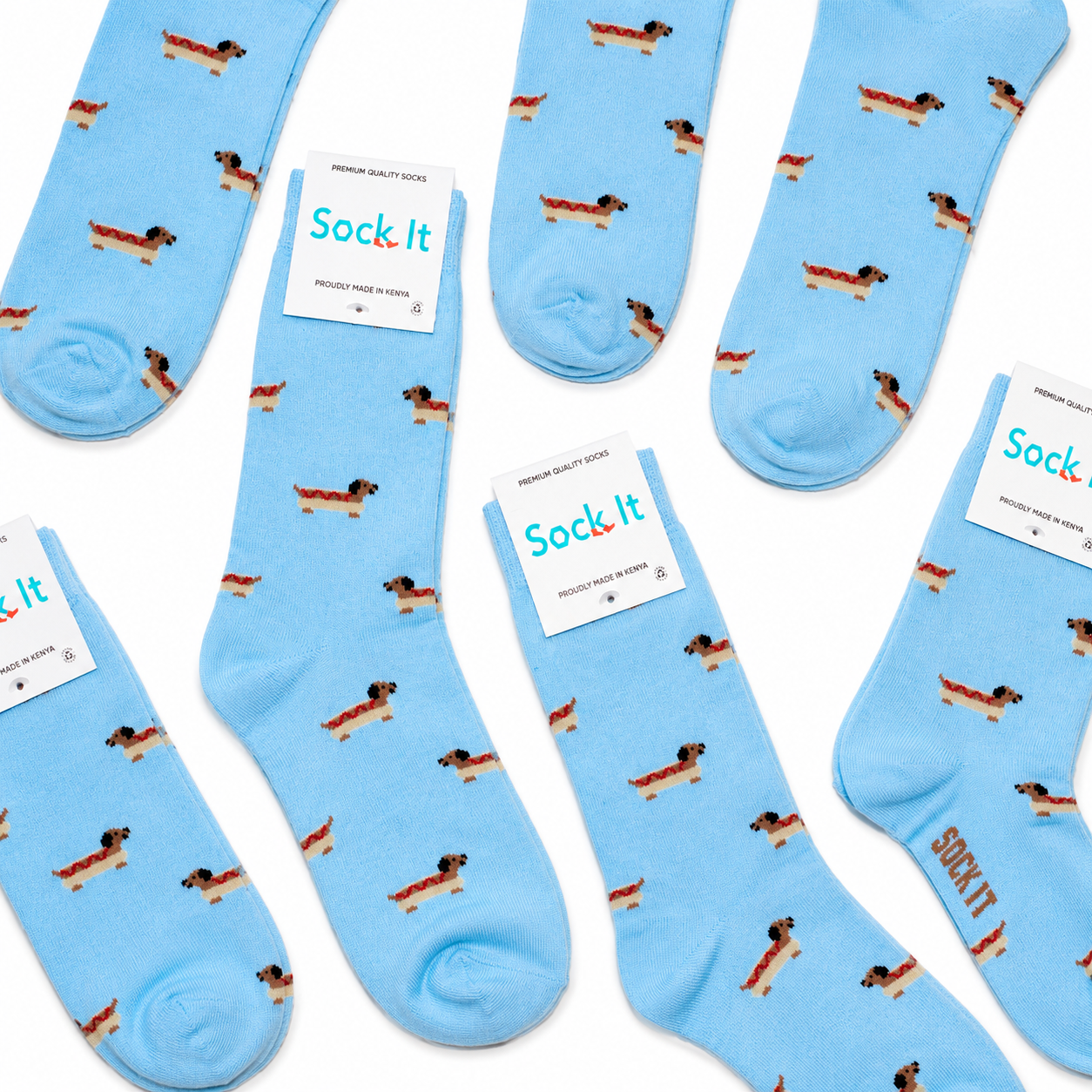 Blue socks with dog pattern and 'Sock It' label on a white background