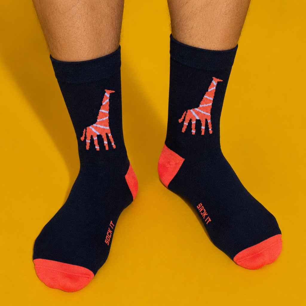 Black socks with red giraffe design on a yellow background