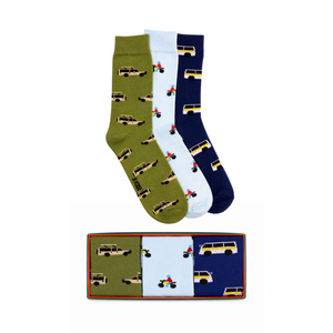 Three pairs of socks with vehicle patterns in a box on a white background